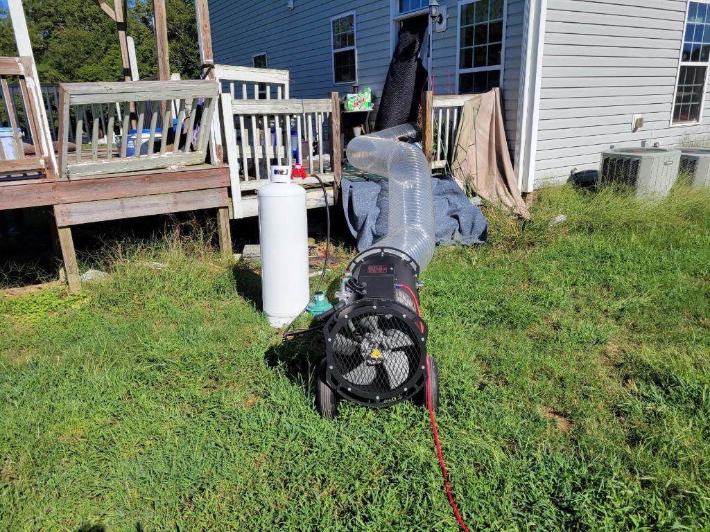 Thermal remediation hose feeding heated air into an interior treatment area