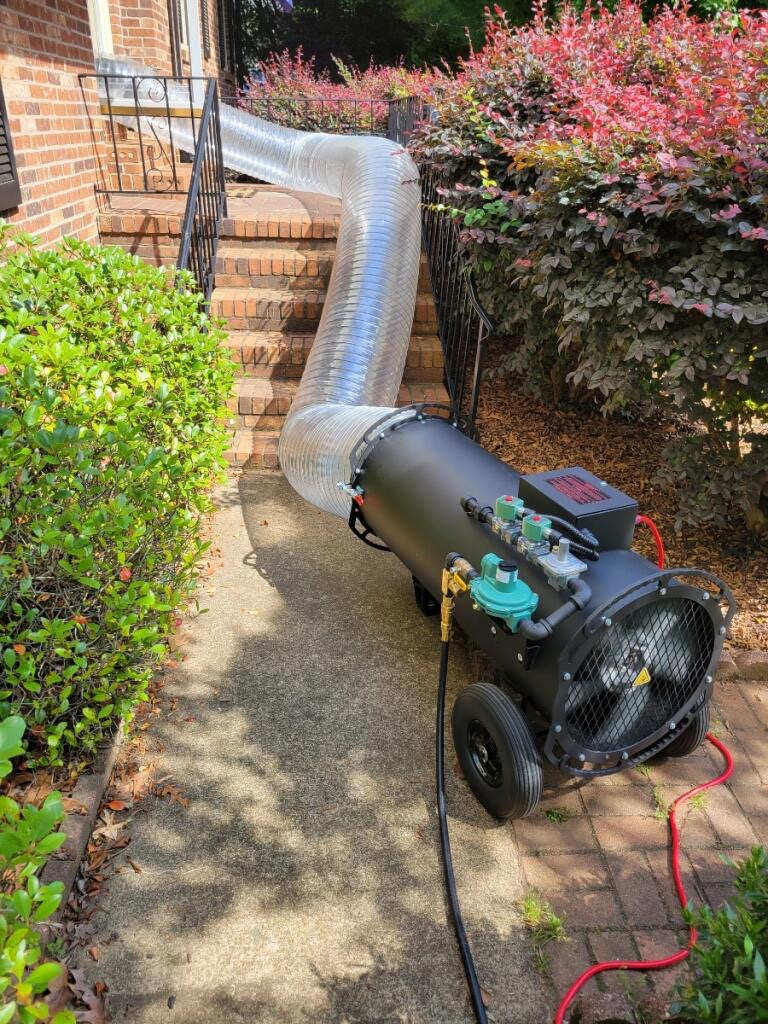 Heat treatment equipment and ducting staged along a walkway for a South Carolina bed bug service